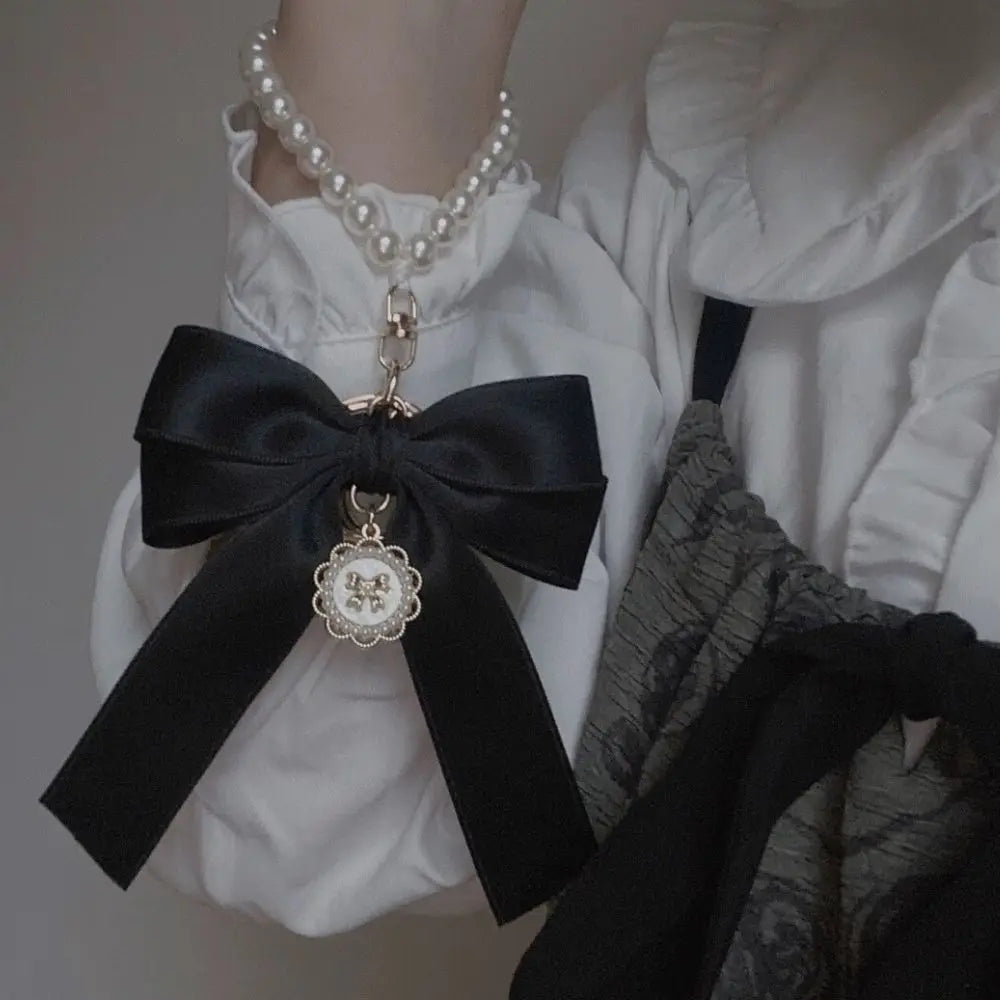 Helmi rusettikoristeinen avaimenperä